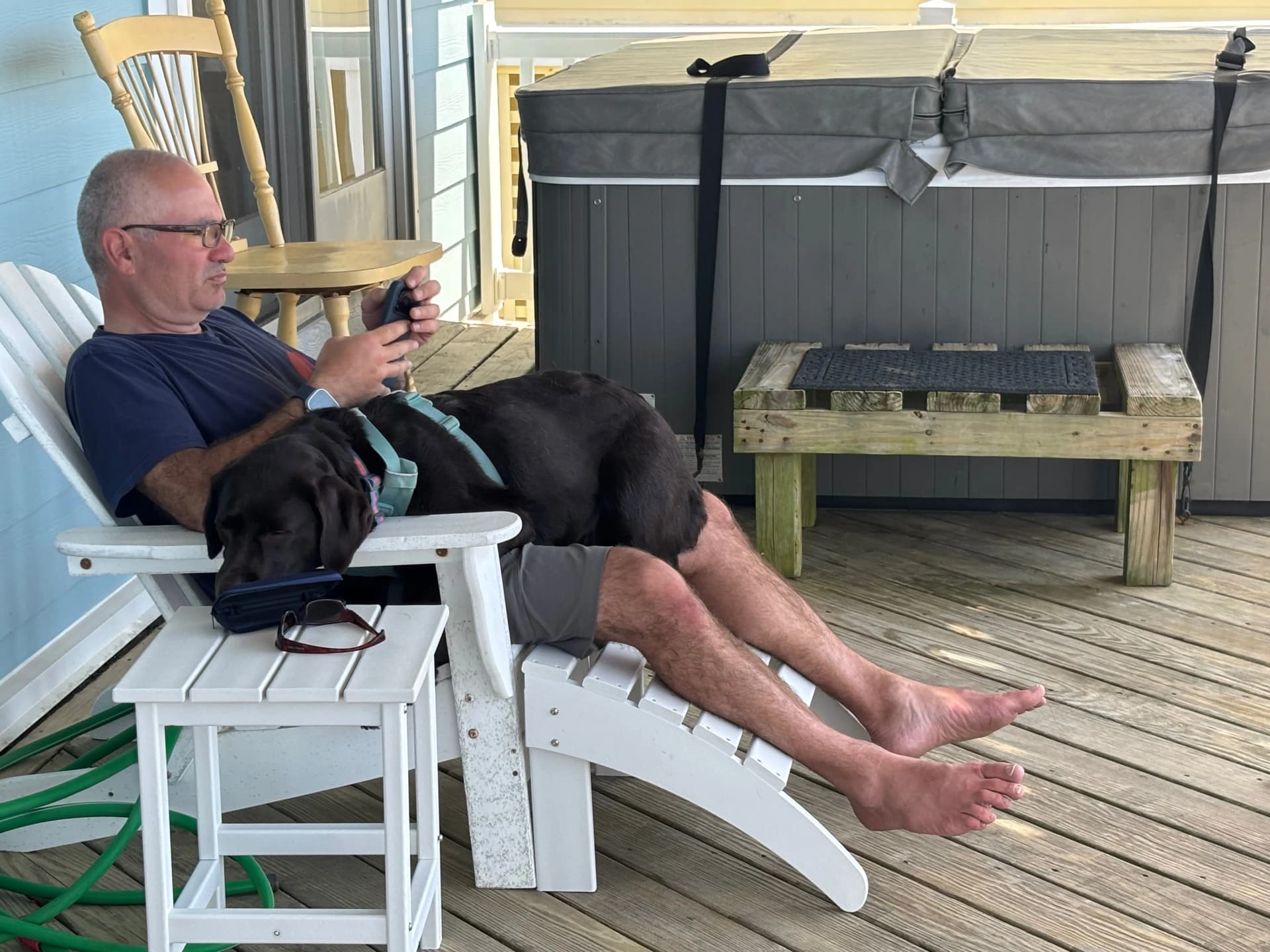 Zoey is resting on Baskin while Baskin is checking the wind conditions