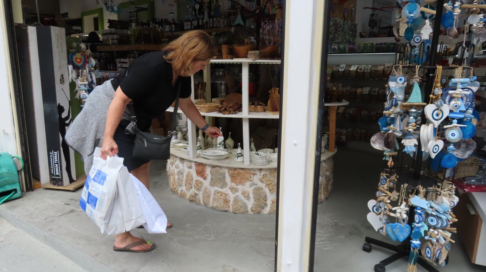 Kelly checking merchandise in Ziya, Kos, Greece